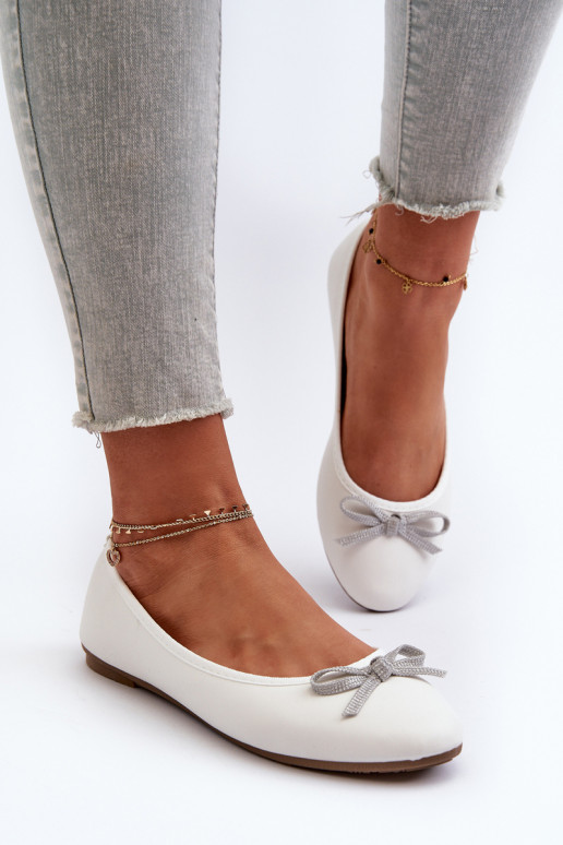 White eco leather ballerina flats with a bow