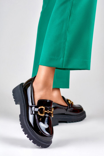 Patent black women's moccasins with decorative detail