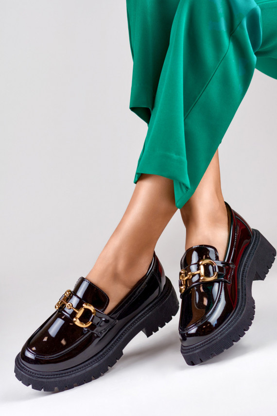 Patent black women's moccasins with decorative detail
