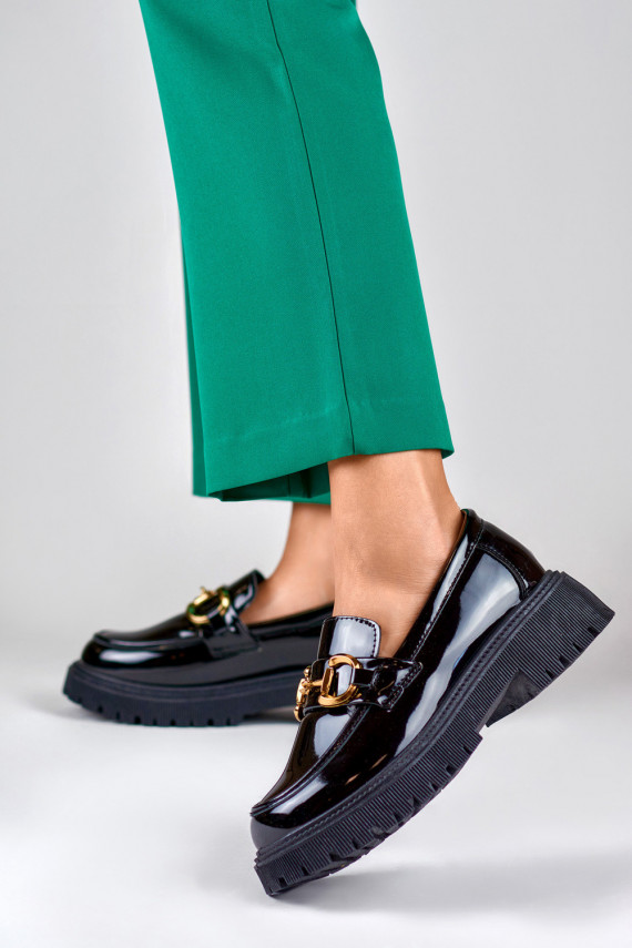 Patent black women's moccasins with decorative detail