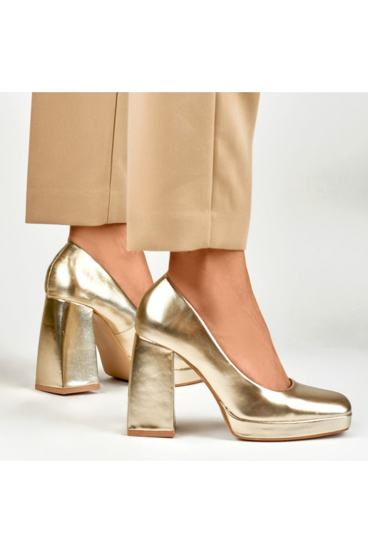 High heels with a wide heel in gold...