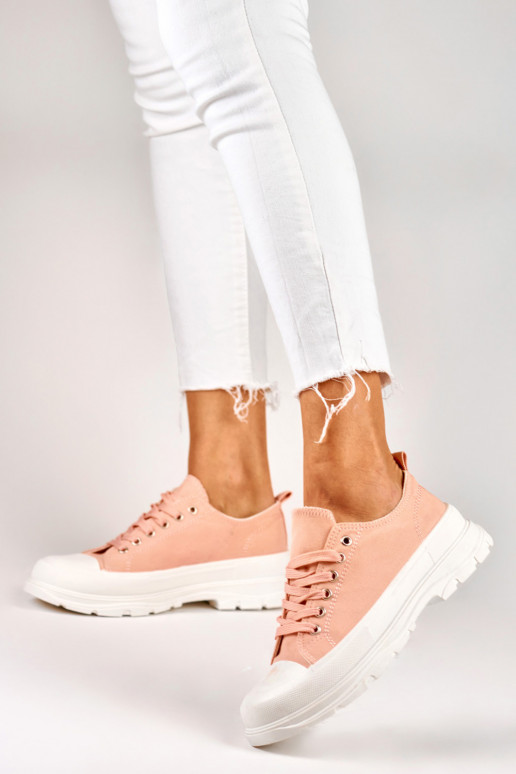 Pink sneakers on a low platform