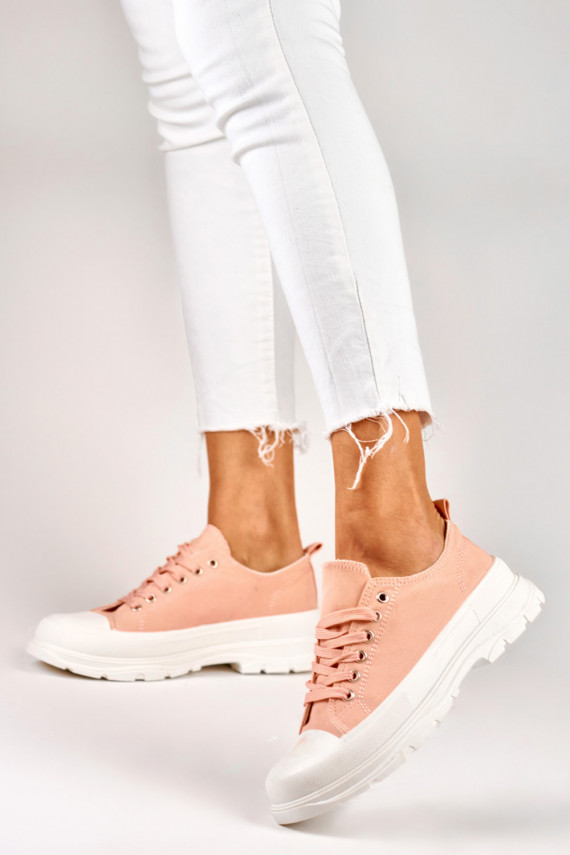 Pink sneakers on a low platform