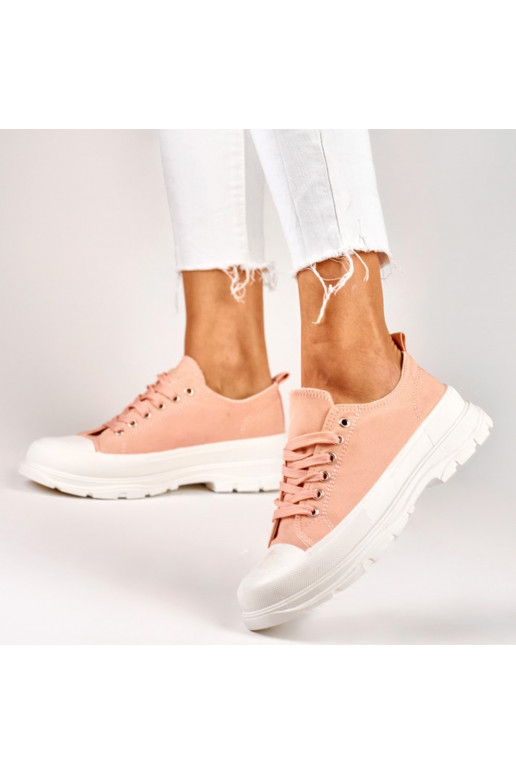 Pink sneakers on a low platform