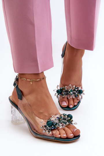 Transparent sandals on a heel with decorations in green D&A