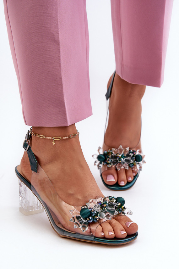 Transparent sandals on a heel with decorations in green D&A
