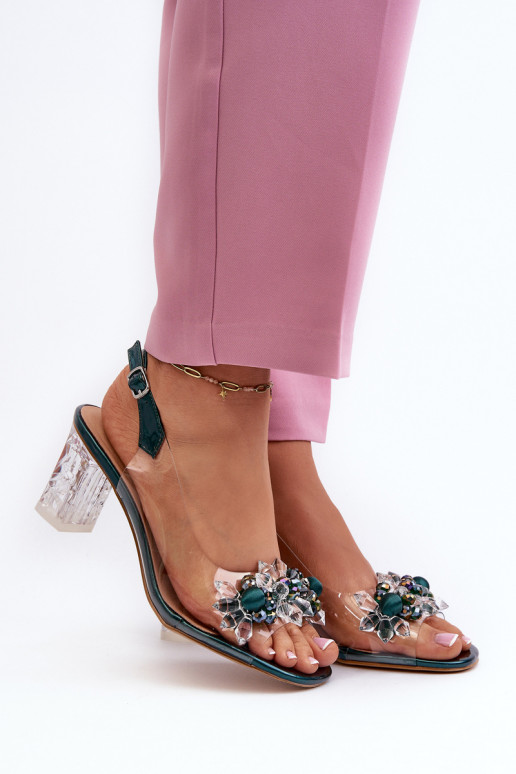 Transparent sandals on a heel with decorations in green D&A