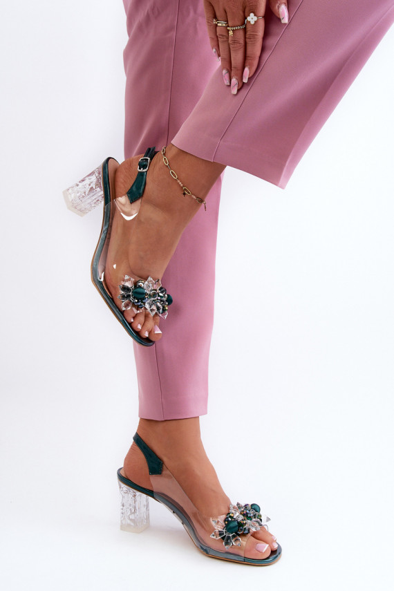 Transparent sandals on a heel with decorations in green D&A