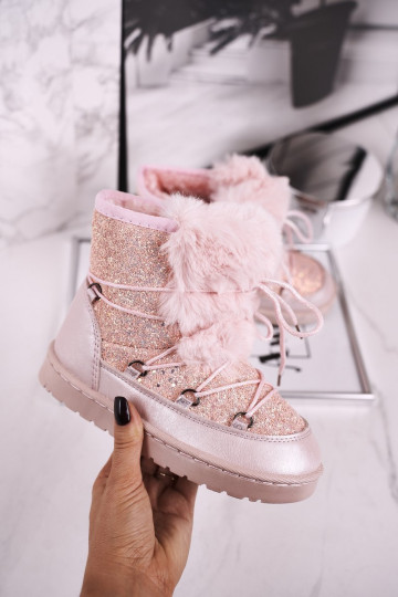 Children's snow boots are warmed in pink color
