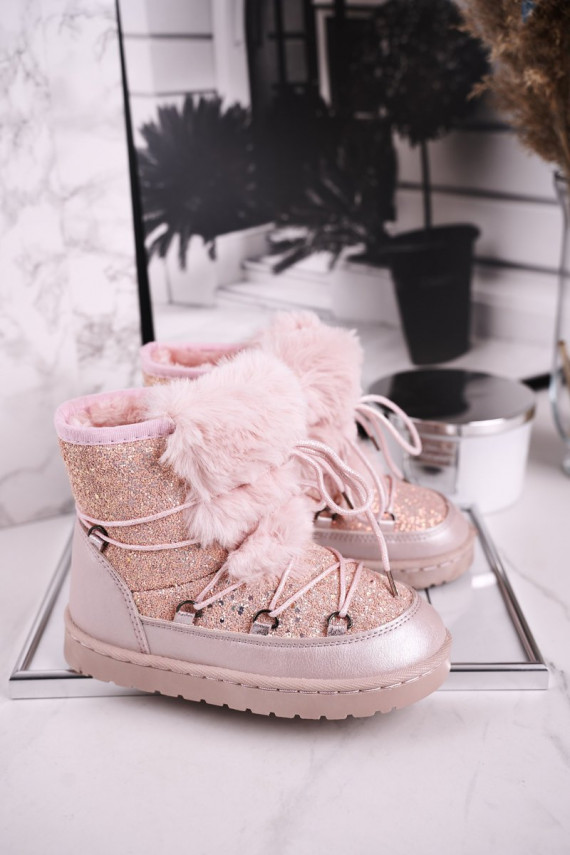 Children's snow boots are warmed in pink color