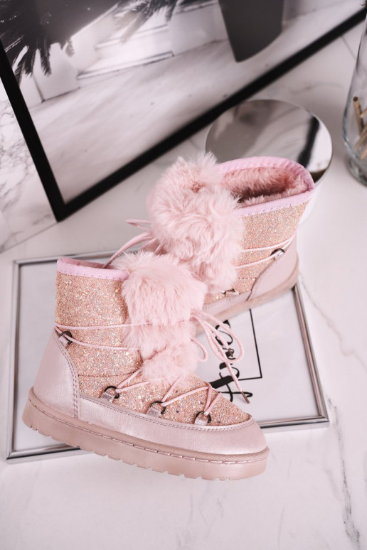 Children's snow boots are warmed in pink color