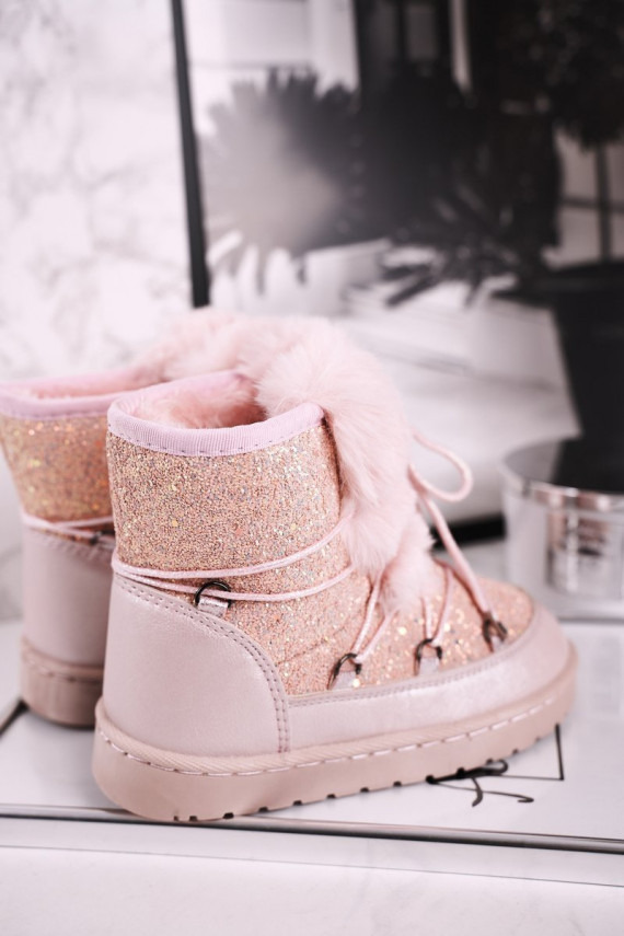 Children's snow boots are warmed in pink color