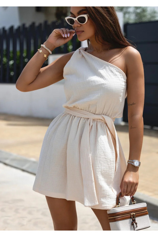 Kori is a cream muslin mini dress Kori is a cream muslin mini dress