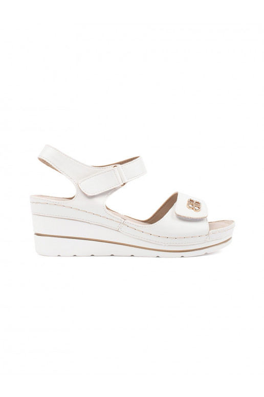 White color comfortable sandals on a wedge