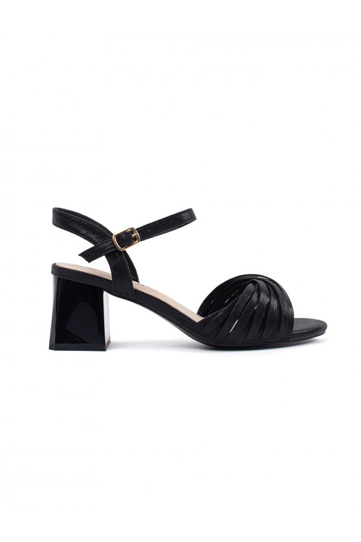 black elegant sandals on a low post