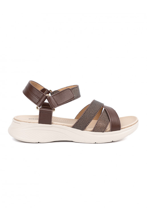 Brown color sandals on a white platform