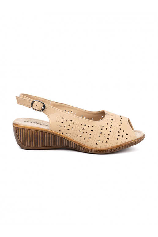 beige openwork sandals on a wedge