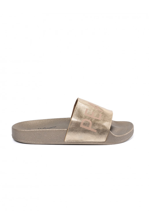 gold color slippers  flat with the inscription
