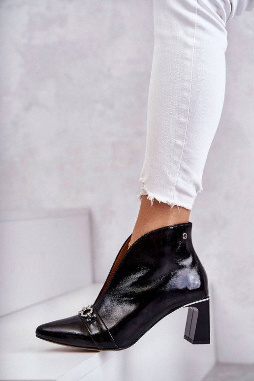 Leather boots on a post Black