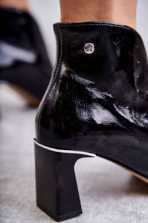 Leather boots on a post Black