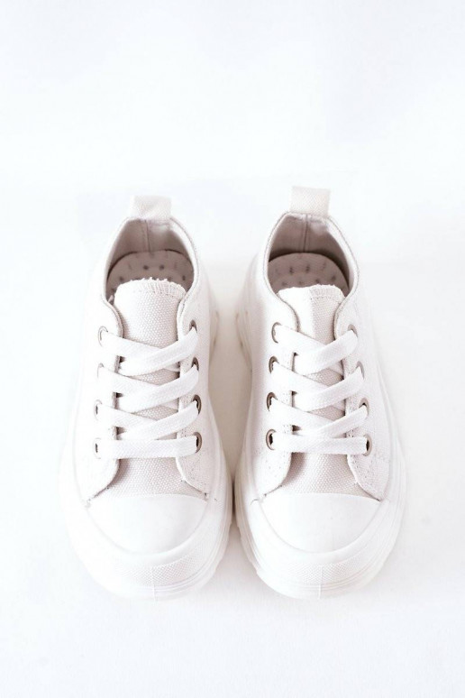 Children's Sneakers On A Platform...