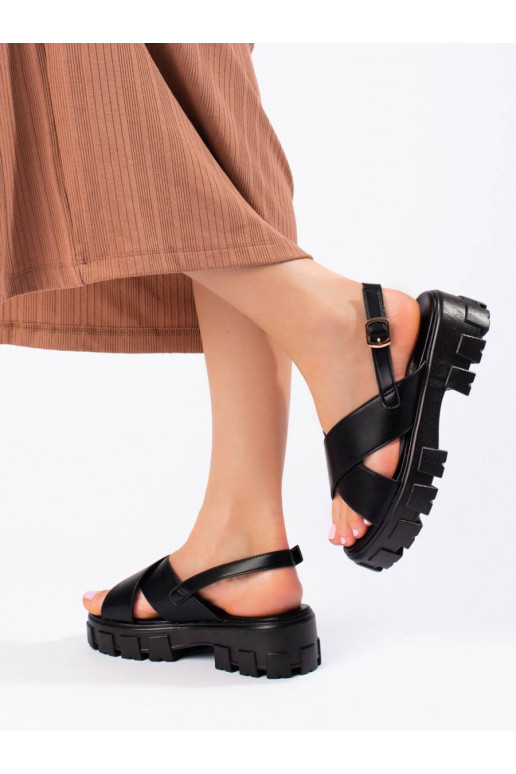 Black sandals on a thick platform...