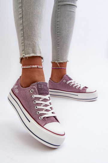 Women's sneakers on a thick...